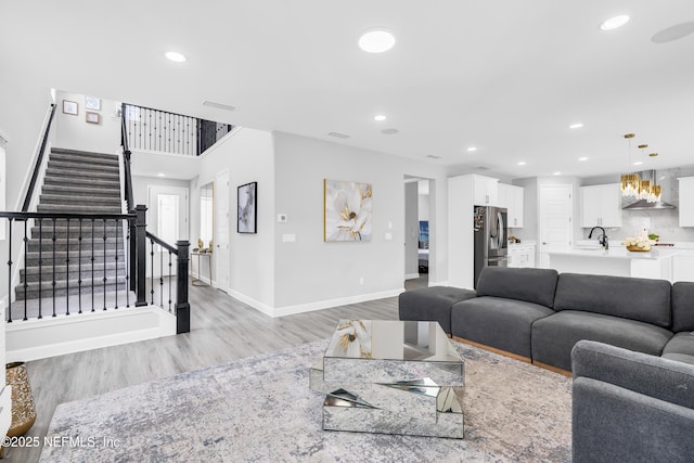 194 Napo Way, Saint Johns, FL 32259 - living room featuring light wood-style floors, stairs, and recessed lighting