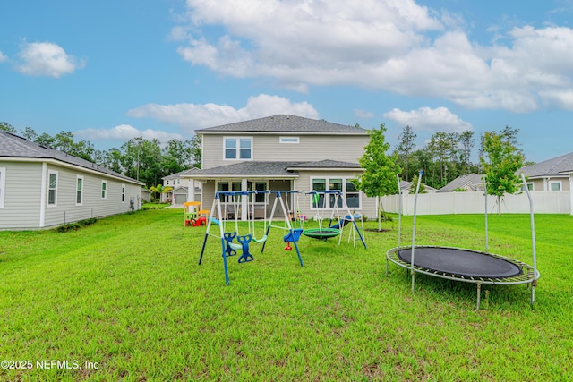 194 Napo Way, Saint Johns, FL 32259 - rear view of house with a trampoline and a playground
