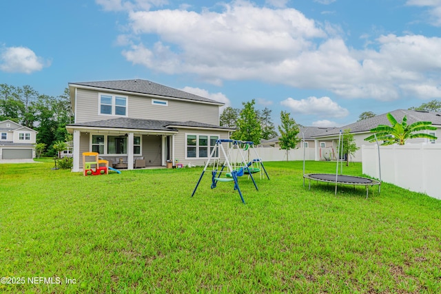 194 Napo Way, Saint Johns, FL 32259 - rear view of property with a trampoline and a playground