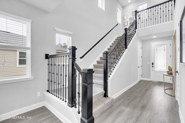 194 Napo Way, Saint Johns, FL 32259 - entryway with wood finished floors, a towering ceiling, stairway, and recessed lighting
