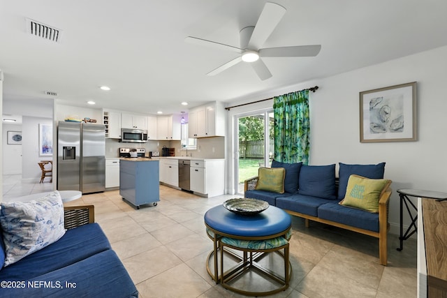 2734 Colonies Dr, Jacksonville Beach, FL 32250 - living area featuring a ceiling fan, light tile patterned floors, recessed lighting, and baseboards