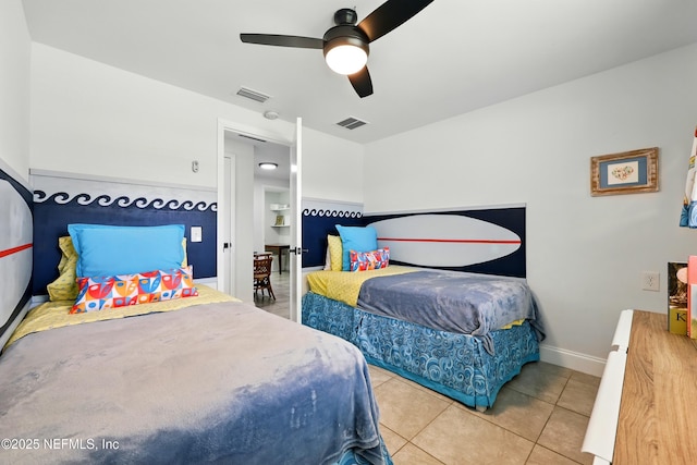 2734 Colonies Dr, Jacksonville Beach, FL 32250 - tiled bedroom with a ceiling fan and baseboards
