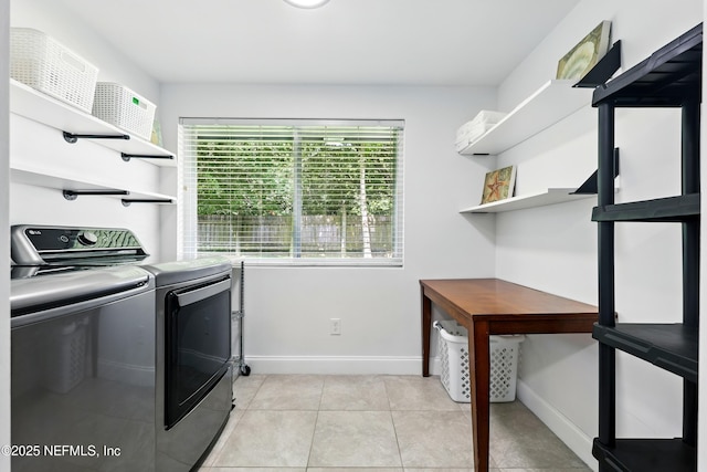 2734 Colonies Dr, Jacksonville Beach, FL 32250 - laundry room featuring washing machine and clothes dryer, baseboards, and light tile patterned flooring