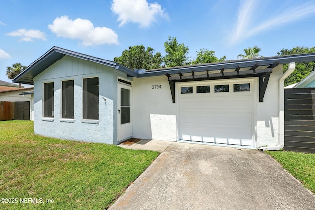 2734 Colonies Dr, Jacksonville Beach, FL 32250 - single story home featuring concrete driveway, a front yard, an attached garage, and stucco siding
