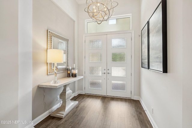 1332 N Loop Pkwy, Saint Augustine, FL 32095 - foyer with french doors, dark wood-style flooring, and a chandelier
