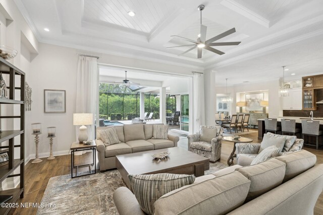 1332 N Loop Pkwy, Saint Augustine, FL 32095 - living room with a ceiling fan, coffered ceiling, crown molding, recessed lighting, and dark wood finished floors