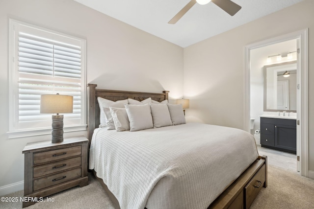 1332 N Loop Pkwy, Saint Augustine, FL 32095 - bedroom featuring light carpet, connected bathroom, and a ceiling fan