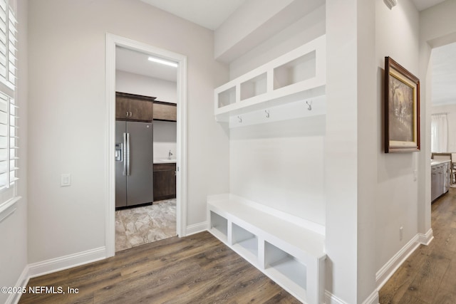 1332 N Loop Pkwy, Saint Augustine, FL 32095 - mudroom featuring dark wood-type flooring and plenty of natural light