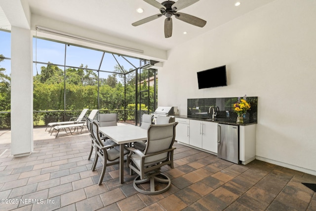 1332 N Loop Pkwy, Saint Augustine, FL 32095 - view of patio featuring exterior kitchen, ceiling fan, a lanai, and outdoor dining area