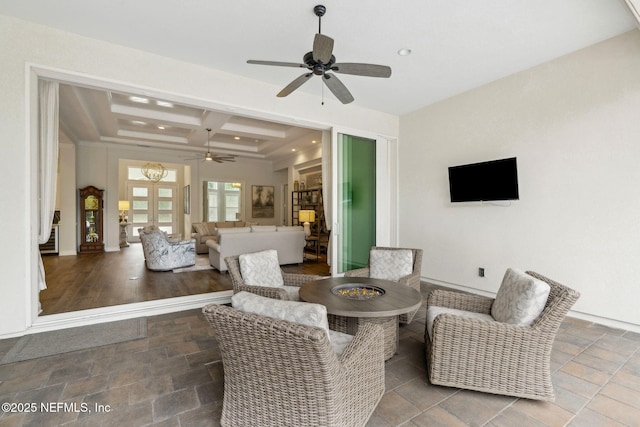 1332 N Loop Pkwy, Saint Augustine, FL 32095 - living area featuring a ceiling fan, coffered ceiling, stone tile floors, beamed ceiling, and recessed lighting