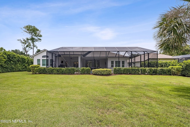 1332 N Loop Pkwy, Saint Augustine, FL 32095 - back of property featuring a lawn and glass enclosure