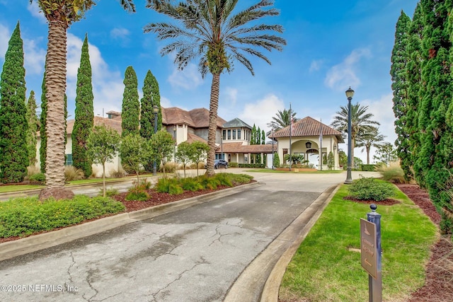 1332 N Loop Pkwy, Saint Augustine, FL 32095 - view of front of house featuring stucco siding, driveway, and a tiled roof