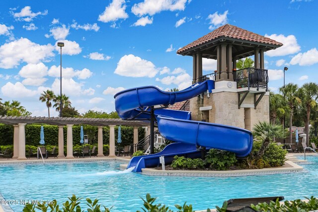 1332 N Loop Pkwy, Saint Augustine, FL 32095 - community pool featuring a water slide