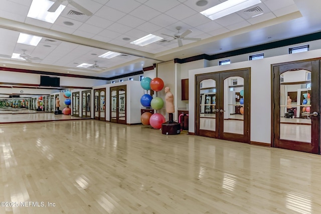 1332 N Loop Pkwy, Saint Augustine, FL 32095 - workout area with french doors, a ceiling fan, wood finished floors, and a paneled ceiling