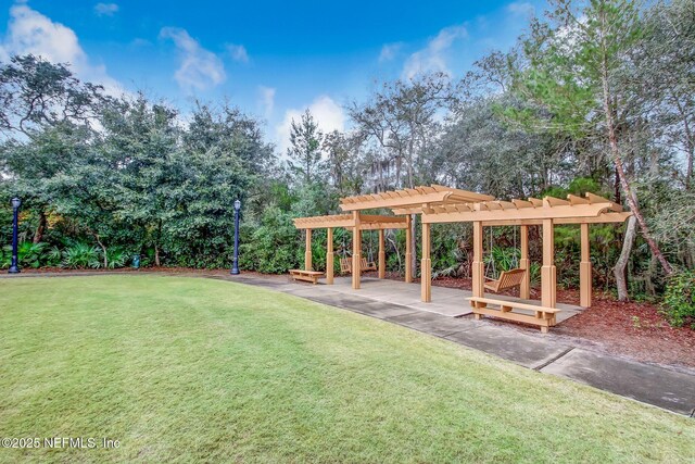1332 N Loop Pkwy, Saint Augustine, FL 32095 - view of green lawn featuring a pergola