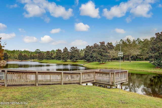 1332 N Loop Pkwy, Saint Augustine, FL 32095 - dock area with a water view, a lawn, and view of wooded area