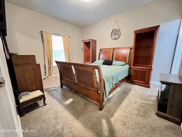 3610 Kirkpatrick Cir Unit 8, Jacksonville, FL 32210 - carpeted bedroom featuring a textured ceiling and baseboards