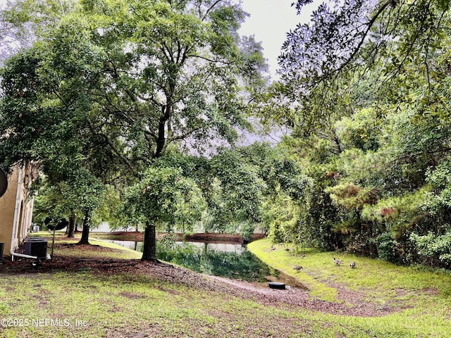 3610 Kirkpatrick Cir Unit 8, Jacksonville, FL 32210 - view of yard featuring central AC