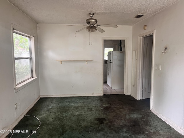 3526 Poinsetta St, Jacksonville, FL 32254 - carpeted empty room featuring a ceiling fan and a textured ceiling