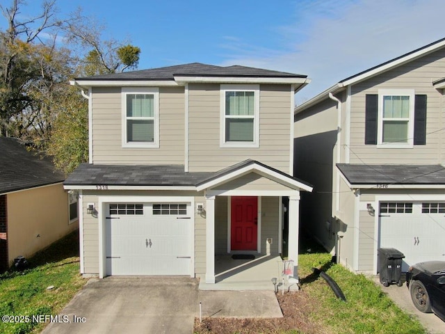 1318 Lake Shore Blvd, Jacksonville, FL 32205 - traditional-style house featuring an attached garage, driveway, and roof with shingles