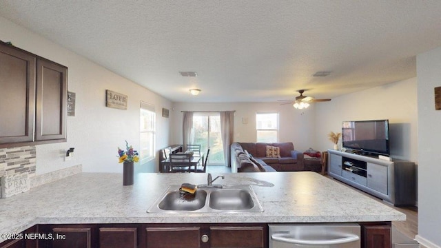 1318 Lake Shore Blvd, Jacksonville, FL 32205 - kitchen with a sink, open floor plan, dark brown cabinetry, and a textured ceiling
