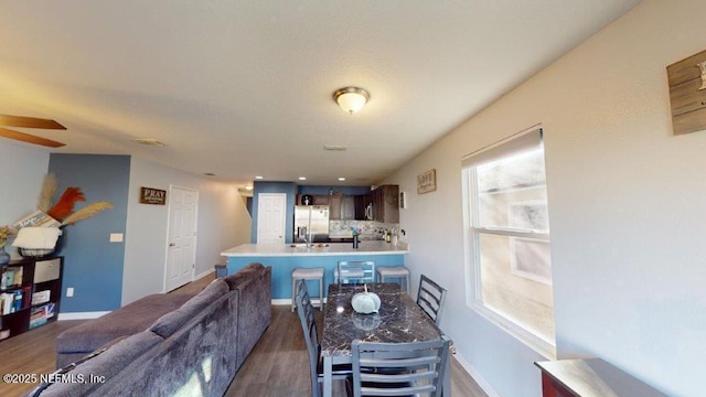 1318 Lake Shore Blvd, Jacksonville, FL 32205 - living area featuring wood finished floors, ceiling fan, and baseboards