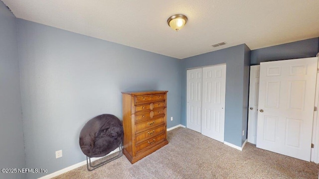 1318 Lake Shore Blvd, Jacksonville, FL 32205 - carpeted bedroom featuring a closet and baseboards