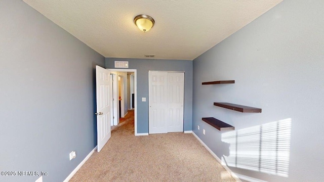 1318 Lake Shore Blvd, Jacksonville, FL 32205 - corridor with carpet floors, baseboards, and a textured ceiling