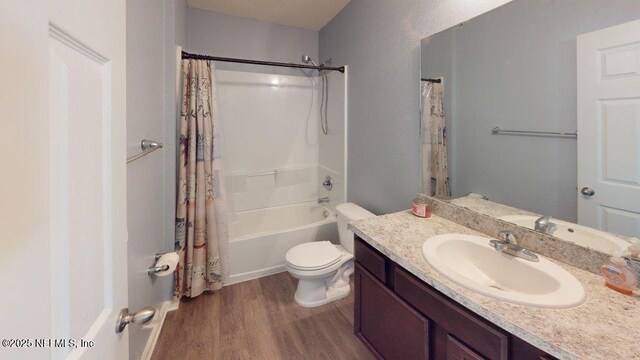 1318 Lake Shore Blvd, Jacksonville, FL 32205 - bathroom featuring wood finished floors, vanity, shower / bath combo, and toilet