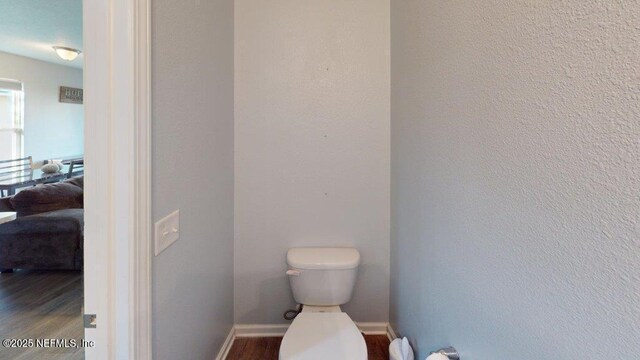 1318 Lake Shore Blvd, Jacksonville, FL 32205 - bathroom with toilet, wood finished floors, and baseboards
