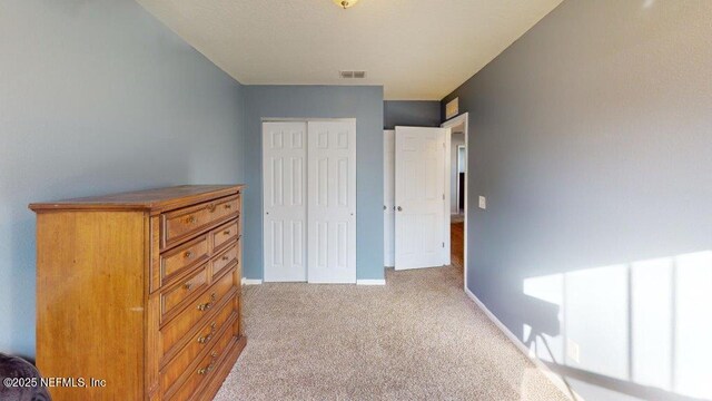 1318 Lake Shore Blvd, Jacksonville, FL 32205 - bedroom featuring carpet floors, a closet, and baseboards