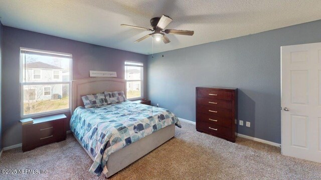 1318 Lake Shore Blvd, Jacksonville, FL 32205 - bedroom featuring carpet flooring, a textured ceiling, ceiling fan, and baseboards