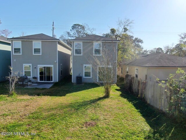1318 Lake Shore Blvd, Jacksonville, FL 32205 - back of property with stucco siding, central air condition unit, and a patio area