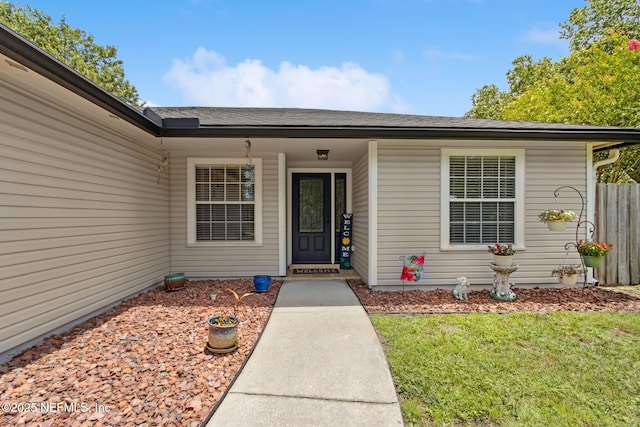 11087 Danzig Way, Jacksonville, FL 32257 - doorway to property with a lawn
