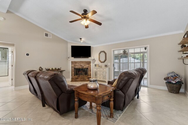 11087 Danzig Way, Jacksonville, FL 32257 - living room with lofted ceiling, ornamental molding, ceiling fan, light tile patterned floors, and a brick fireplace