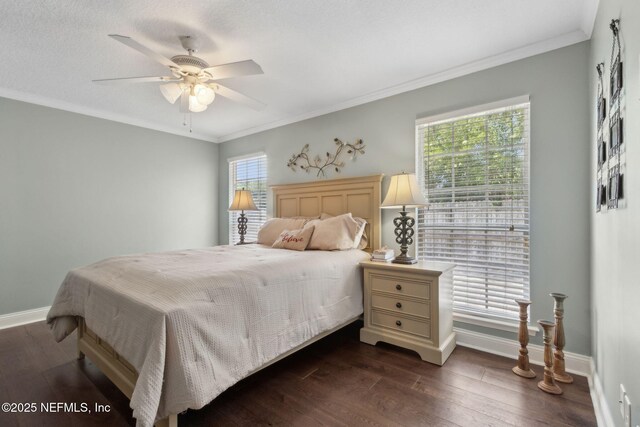 11087 Danzig Way, Jacksonville, FL 32257 - bedroom featuring baseboards, dark wood finished floors, crown molding, and a ceiling fan