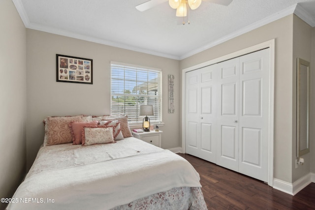 11087 Danzig Way, Jacksonville, FL 32257 - bedroom featuring crown molding, dark wood-type flooring, baseboards, a closet, and ceiling fan