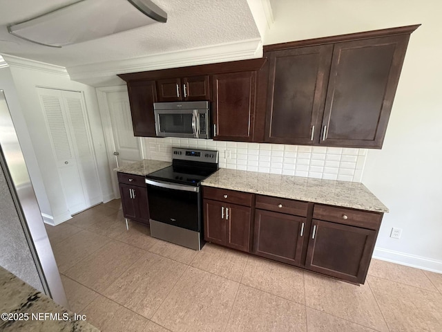 2406 Oakview Dr, Jacksonville, FL 32246 - kitchen with stainless steel appliances, decorative backsplash, baseboards, dark brown cabinets, and crown molding