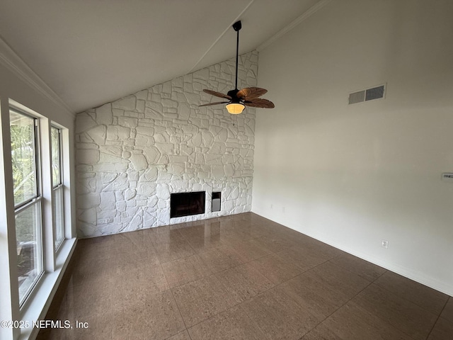 2406 Oakview Dr, Jacksonville, FL 32246 - unfurnished living room featuring ceiling fan, a stone fireplace, ornamental molding, high vaulted ceiling, and baseboards