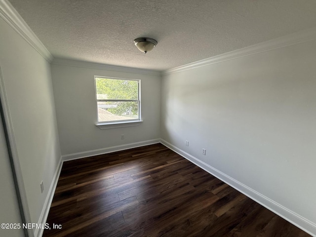 2406 Oakview Dr, Jacksonville, FL 32246 - spare room featuring dark wood-style flooring, a textured ceiling, crown molding, and baseboards