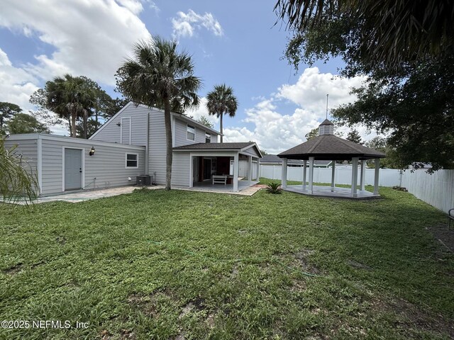 2406 Oakview Dr, Jacksonville, FL 32246 - rear view of house with a gazebo, a patio, and central AC