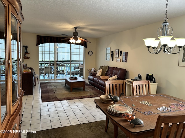 1830 Sevilla Blvd Unit 207, Atlantic Beach, FL 32233 - dining space with light tile patterned flooring, a ceiling fan, a chandelier, and a textured ceiling