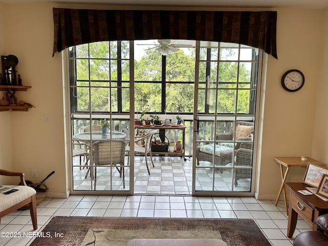 1830 Sevilla Blvd Unit 207, Atlantic Beach, FL 32233 - doorway to outside featuring ceiling fan, light tile patterned floors, and baseboards
