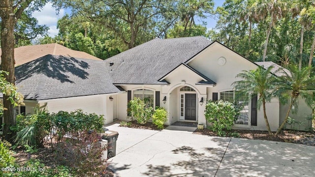 2227 Barefoot Trce, Atlantic Beach, FL 32233 - view of front of house with roof with shingles and stucco siding