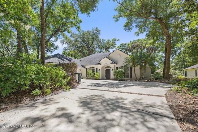 2227 Barefoot Trce, Atlantic Beach, FL 32233 - view of front of property with concrete driveway and stucco siding