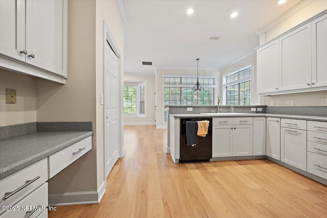 2227 Barefoot Trce, Atlantic Beach, FL 32233 - kitchen with black dishwasher, light wood finished floors, crown molding, recessed lighting, and pendant lighting