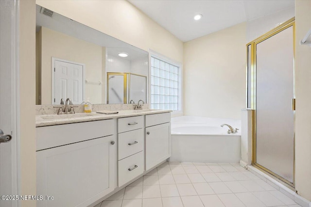 2227 Barefoot Trce, Atlantic Beach, FL 32233 - full bathroom with a shower stall, a bath, double vanity, and recessed lighting