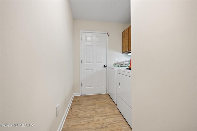 2227 Barefoot Trce, Atlantic Beach, FL 32233 - laundry area with washing machine and dryer, cabinet space, and light wood finished floors