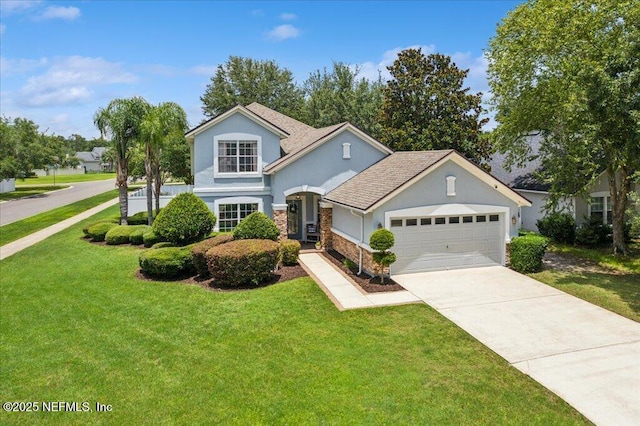 800 Marjories Way, Saint Augustine, FL 32092 - traditional home with stucco siding, a garage, concrete driveway, and a front lawn