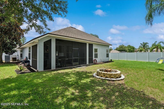 800 Marjories Way, Saint Augustine, FL 32092 - back of property featuring an outdoor fire pit, a fenced backyard, stucco siding, and a sunroom